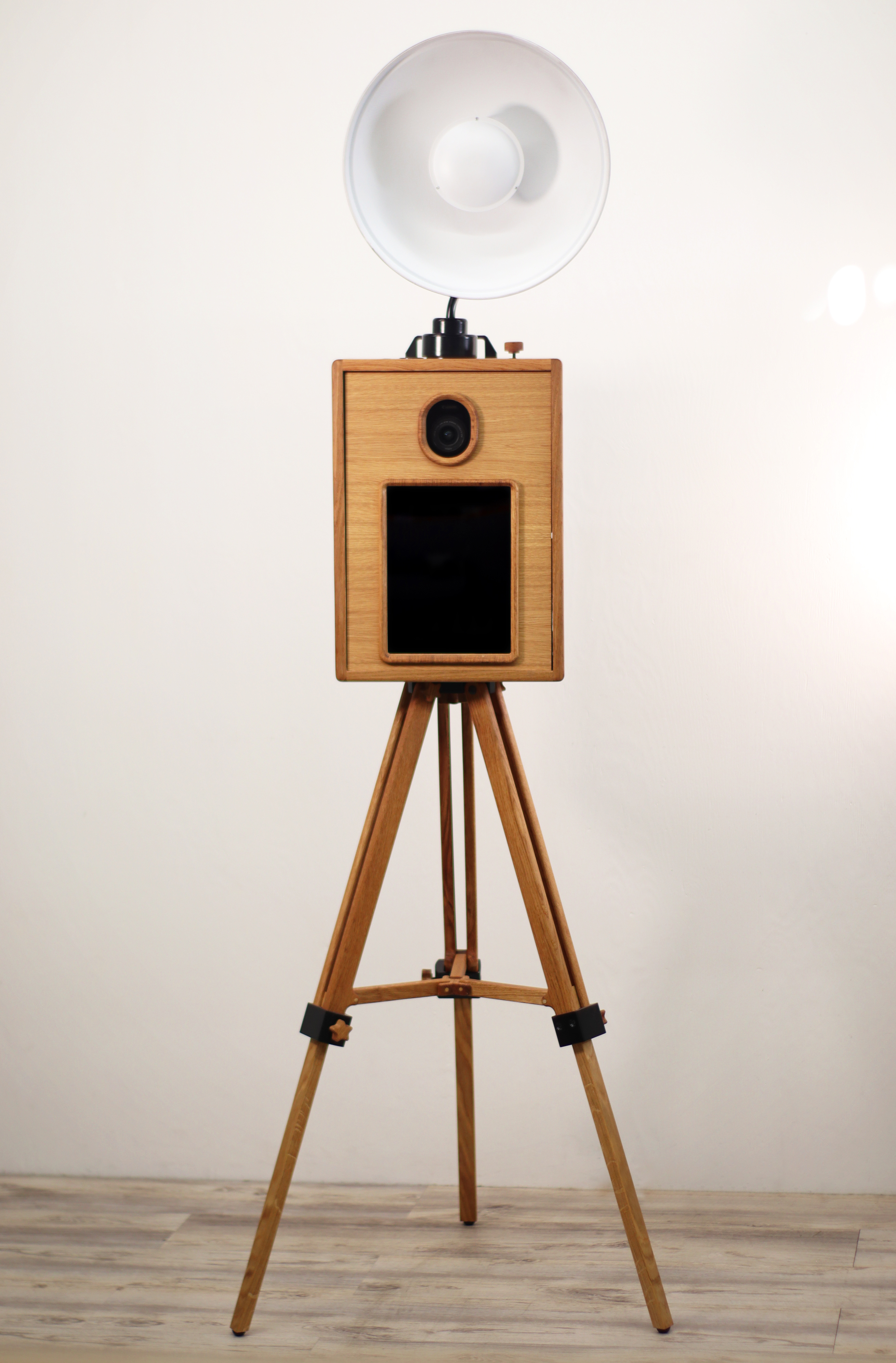 The Evergrain photobooth — walnut + linen open-air booth