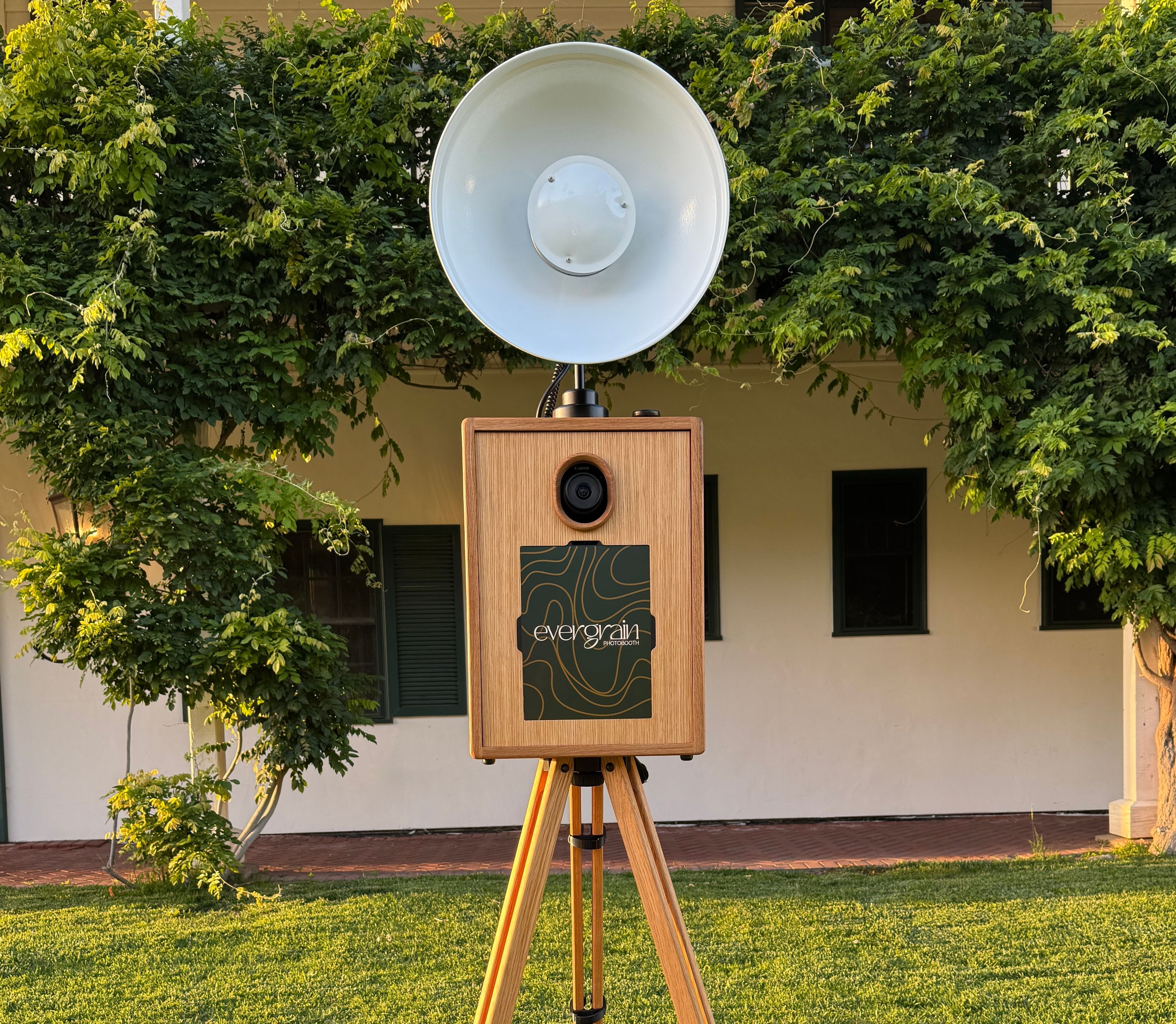Evergrain open-air DSLR photo booth setup on green lawn